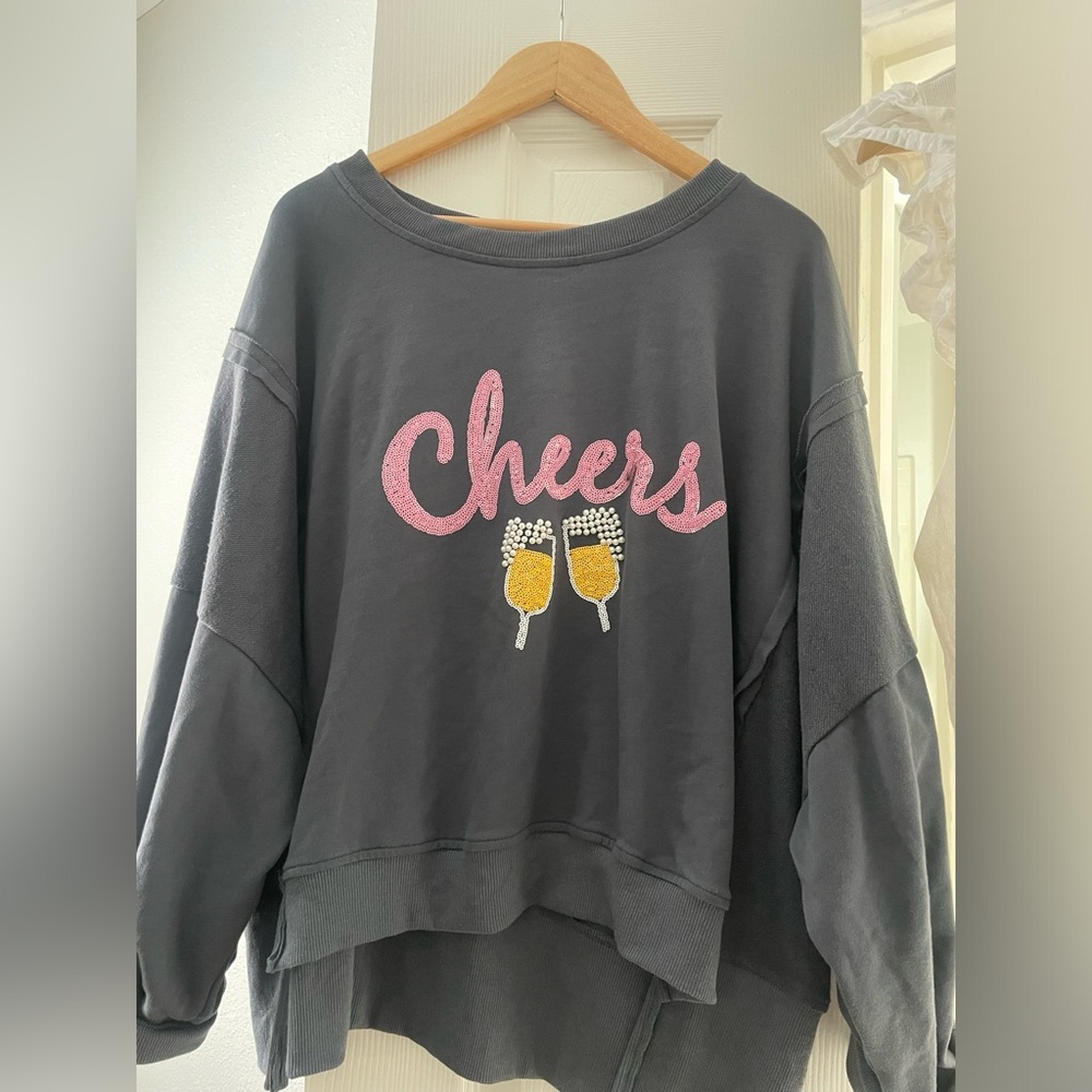 Oversized sweater. Cheers sequin champagne pearls